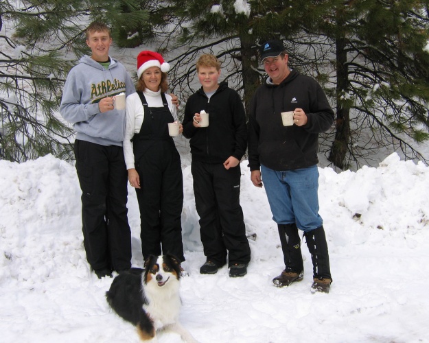 Enjoying some hot chocolate, with Roscoe this time, while hunting for a Christmas tree to cut in 2007