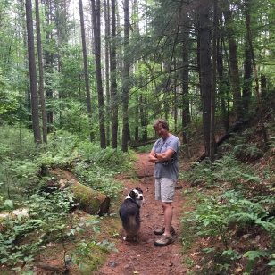 Roscoe hiking the woods near Northwest Bay